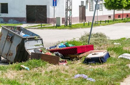 Piles of junk on curb of home to be removed