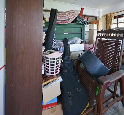 Hoarder home full of junk furniture and random junk objects
